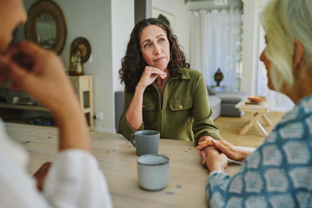 Mature woman supporting a friend during a visit together