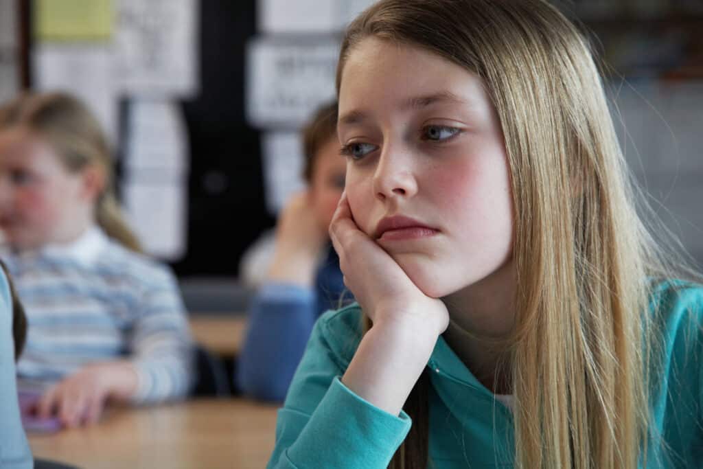 Sad looking girl in classroom