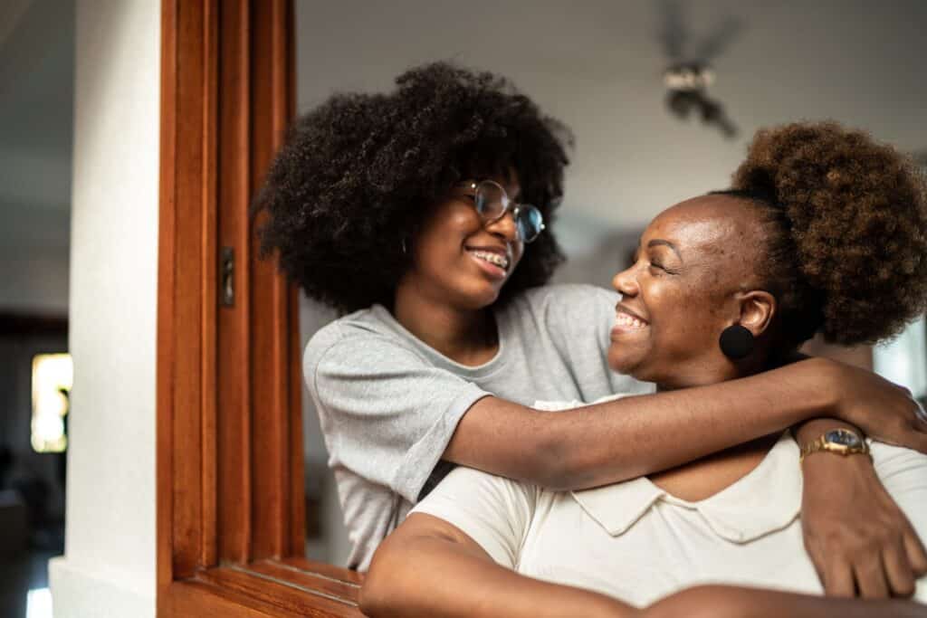 Happy mother and daughter embracing