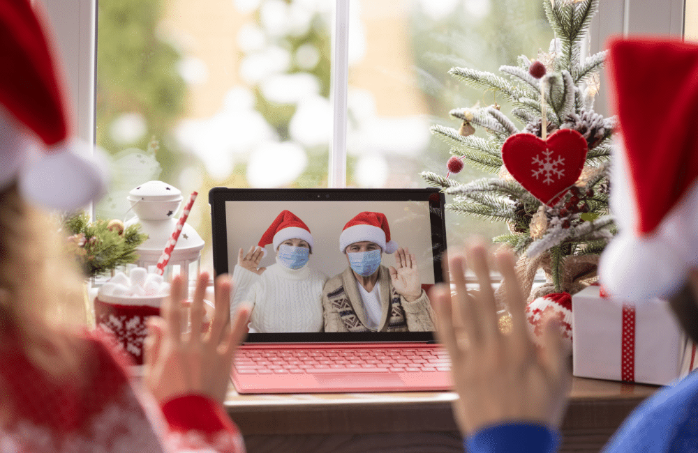 two people on video chat in santa hats