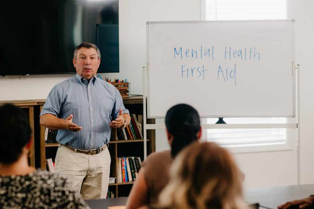 Man speaking at a Mental Health First Aid training