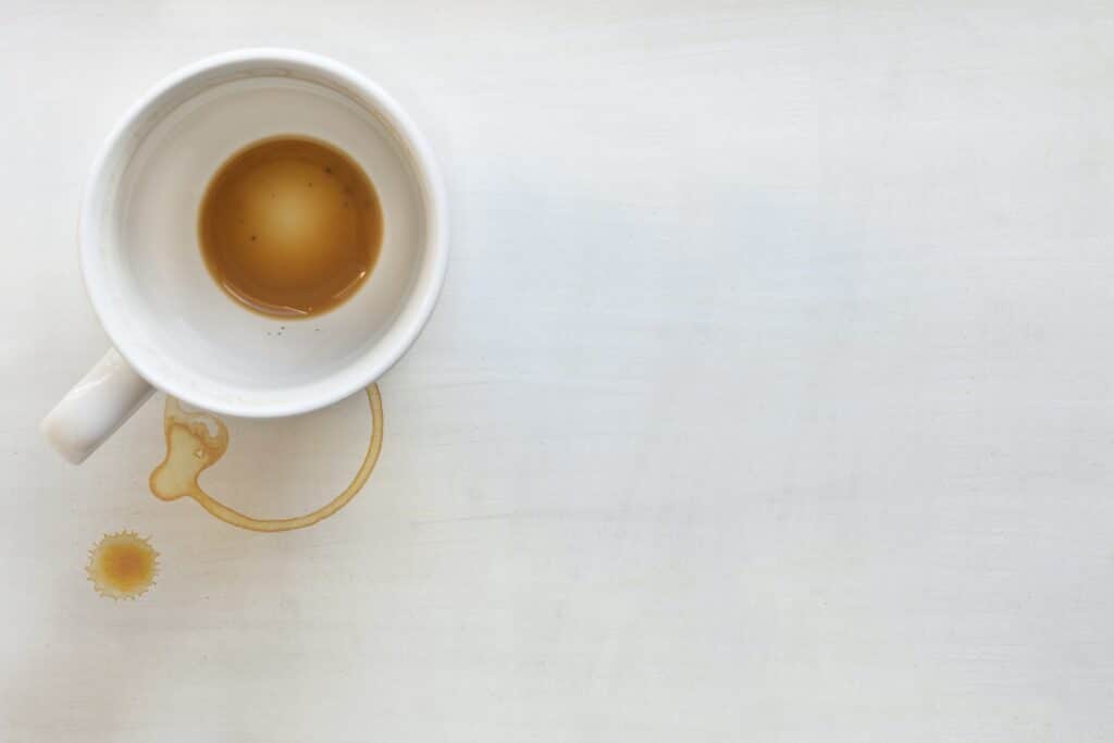 empty coffee cup on white paper