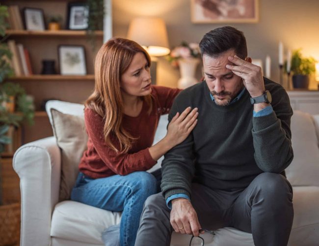 A woman comforts her depressed partner